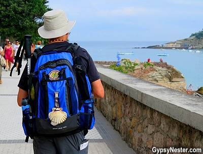 Pilgrims hang a scallop shell on their backpacks with walking the Camino de Santiago in Spain and France. In English, it's called the Way of St. James