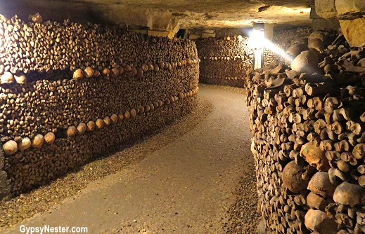 Bones are stacked in a decorative manner at the underground catacombs in Paris, France