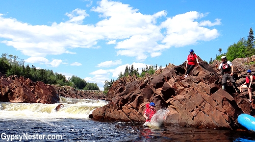 Jumping off a cliff into the Exploits River in Grand Falls - Windsor, Newfoundland, Canada