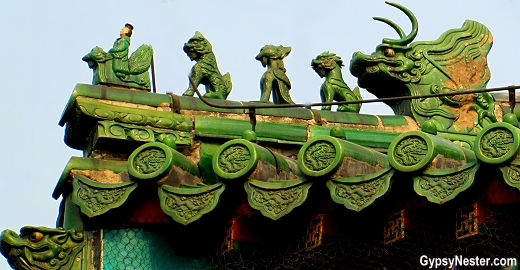 Small statues adorn the corners of the building roofs at The Temple of Heaven in Beijing, China. The more figures, the higher the status of the building.