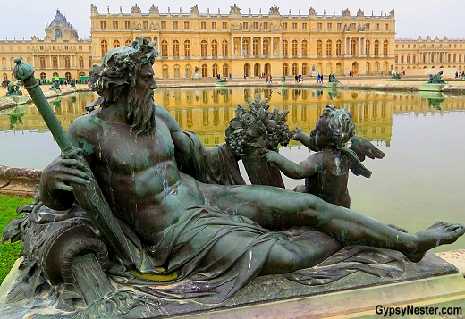 Statue of La Seine in the gardens of Versailles near Paris, France
