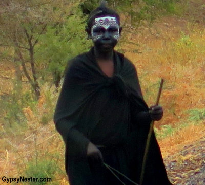 In Tanzania, see several young Maasai men dressed all in black. A closer look reveals that they have painted their faces too. This is the ritual after circumcision and initiation into manhood ceremony to dress this way for several months as they heal. The face paint is to ward off the evil eye. 