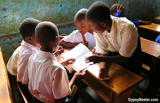 In Tanzanzia, students share workbooks in elementary school