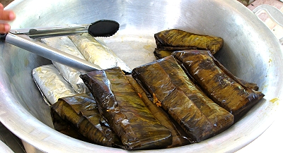 Tamales wrapped in banana leaves, Belize City