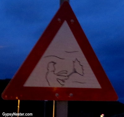 The storm warning sign on the seawall in Bodo, Norway