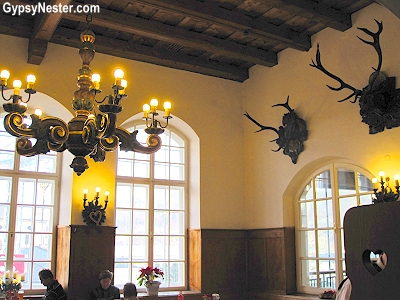 In Salzburg, like any good beer hall, big sturdy tables await mass quantities of food and drink, and animal heads, mostly the kind with antlers, adorn the walls. 