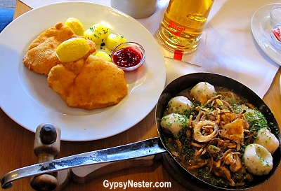 the local bräu, Stiegl, but also excellent authentic dishes. Not having had a schnitzel yet, that was a must, and when we saw six stuffed dumplings mit sauerkraut on the menu we knew what we had to do