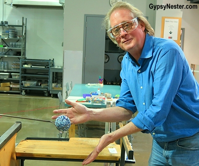 David creates and ornamental ball at the Corning Museum of Glass in New York