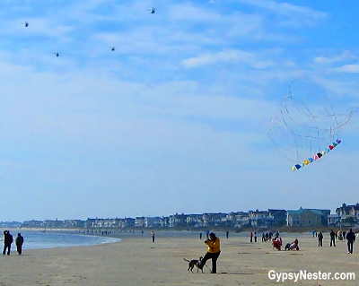 Helicopters and kites fly overhead in Isle of Palms, South Carolina