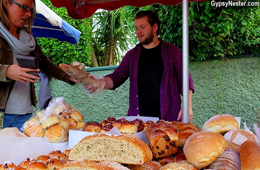 Buying homemade bread at the open air market in Dingle, Ireland