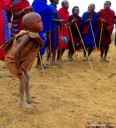 A Maasai boy jumps with the men in Tanzania, Africa. With Discover Corps