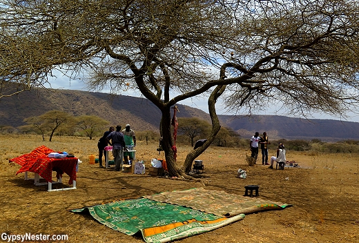 Leaving the Maasai men to their eating of raw internal organs, we head to our own camp and enjoy an incredible outdoor bar-b-que prepared for us under the spreading acacia tree. In Africa with Discover Corps