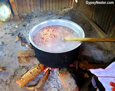 The school in Rau, Tanzania has no electricity, so the kitchen is outside and food is cooked over an open fire