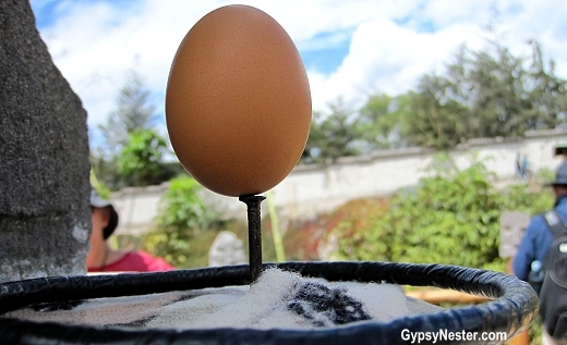 Egg balanced on a head of a nail at the equator