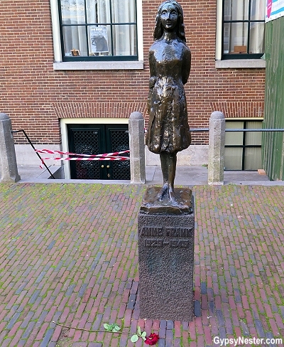 The statue of Anne Frank outside of her hiding place, now The Anne Frank House in Amsterdam, Holland