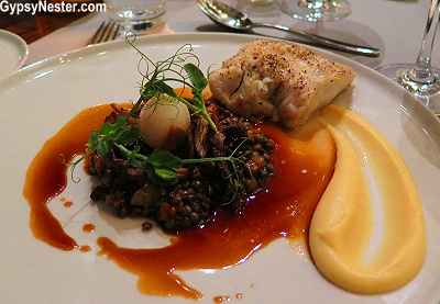 Hake, along with a lentil ragu with mushrooms and a quail egg at Havsmak in Oslo, Norway