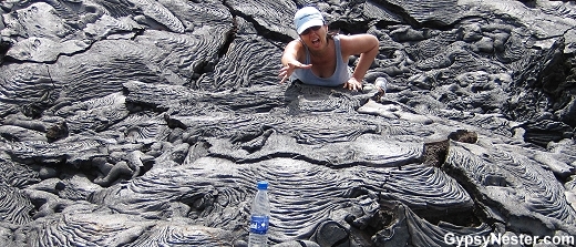 The tropical sun on the black basalt flow takes a toll on Veronica.