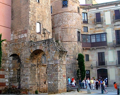 Roman gateway and an aqueduct have been incorporated into the medieval Portal del Bisbe that leads back into the Gothic Quarter