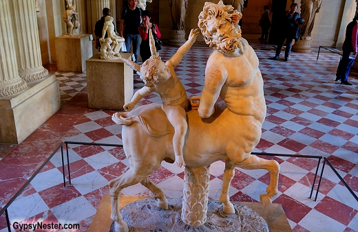 Cupid riding a centaur in the Louvre in Paris, France