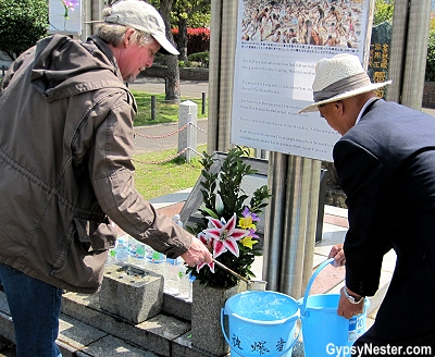 David waters a plant in to honor a atomic bomb survivor in Nagasaki, Japan