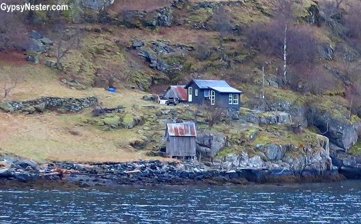 Homes along the fjords on our Norway in a Nutshell tour near Flam