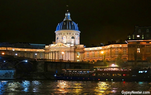 The Bibliothque Mazarine at night during a Seine dinner cruise - GypsyNester.com