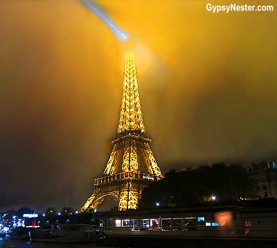 The Eiffel Tour in the fog at night in Paris, France