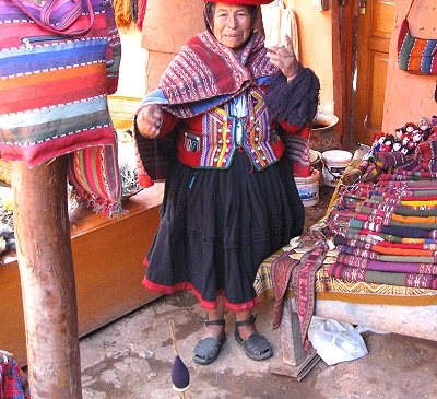 Wool is spun into yarn on small spindles that spin like a toy top