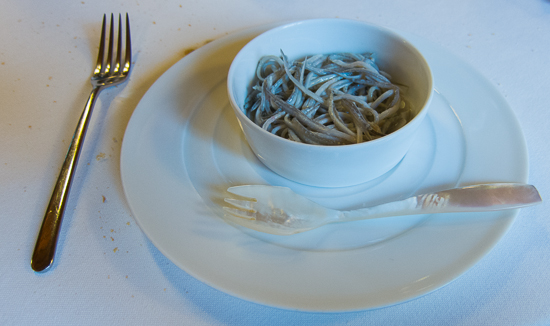 Baby eels with spork in Spain by Tom of Travel Past 50