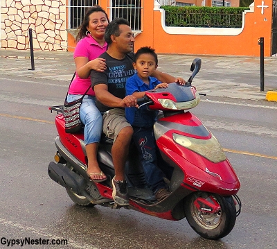 A whole family on one scooter in Piste, Mexico