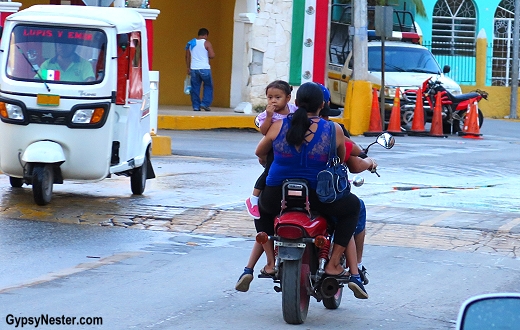 A whole family on one scooter in Piste, Mexico
