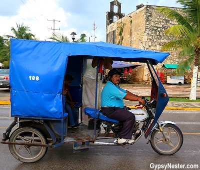 Many motorcycles have been transformed into taxis by adding a back wheel and an enclosed cab in Piste, Mexico