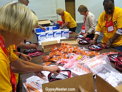 AARP volunteers put together FEMA Emergency Kits at Life@50+ in Miami during the Celebration of Service