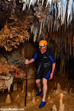 David hikes down into the depths of Rio Secreto near Cancun, Mexico! GypsyNester.com