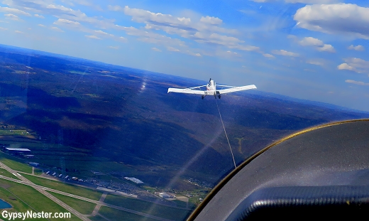 Getting towed in a glider by the tow plane at Harris Hill Soaring