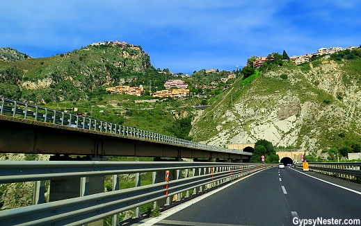 Driving while clinging to the cliffs from Catania to Taormina in Sicily, Italy