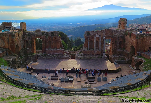 The ancient Greek Theater of Taormina, Sicily with Mt. Etna looming over the stage