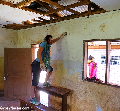 Sanding the walls of our classroom in Tanzania. With Discover Corps