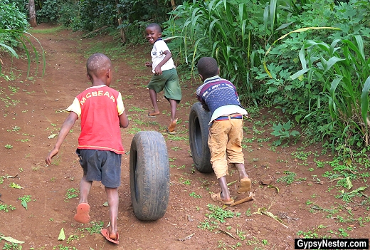 Chagga children roll tires in Tanzania, Africa. With Discover Corps