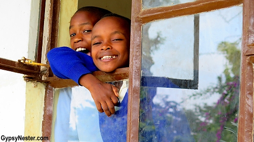 Our students run to their classroom windows as we drive off in the bus everyday. Teaching in Africa with Discover Corps