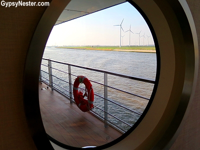 Windmills through the porthole of Viking River Cruises' Skadi